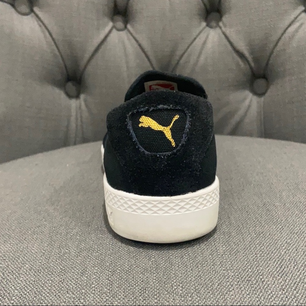 Puma black slip on sneakers